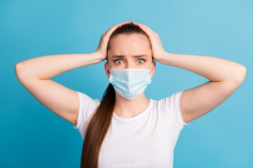 Closeup photo of scared lady keep social distance hospital examination see many people arms on head shocked wear protect face medical mask white t-shirt isolated blue color background