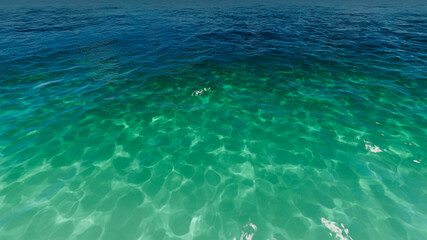 Aerial view of dark blue ocean and light blue sky.