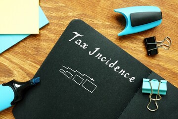 Financial concept about Tax Incidence with sign on the sheet.