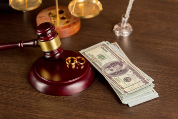 Close-up Of Wedding Rings And Wooden Gavel.