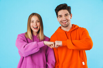 Portrait of a young couple wearing hoodies