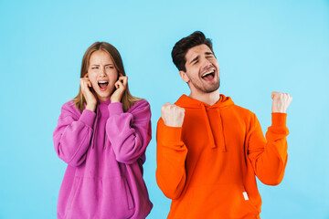 Portrait of a young couple wearing hoodies