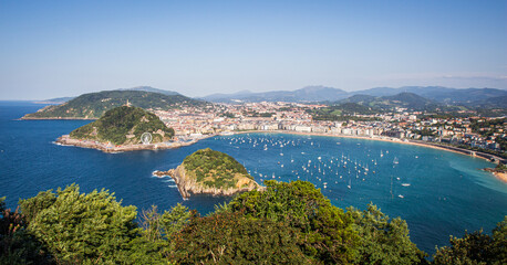 Panoramic view of La Concha bay on a sunny summer day with lots of yachts in the sea