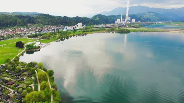 Fly over Velenje Lake towards coal TE&Scaron; Power Station, Slovenia