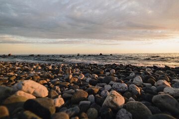 Obraz premium Beautiful sunset on the Black sea. rocks on the sea surf.