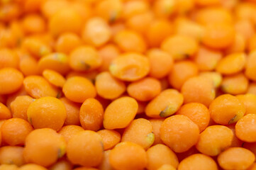 Orange lentil groats close-up. Macro photography