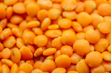 Orange lentil groats close-up. Macro photography
