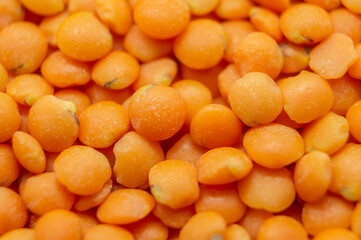 Orange lentil groats close-up. Macro photography