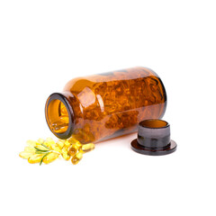 Capsules scattered from a glass bottle