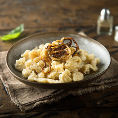 Traditional German noodles with cheese and fried onion