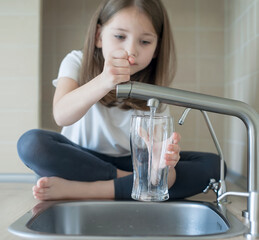 Child open water tap. Kitchen faucet. Glass of clean water. Pouring fresh drink. Hydration. Healthy...
