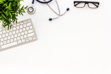 Doctor office desk with keyboard. White table top view space for text