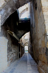 Fototapeta na wymiar evocative image of an ancient street in the historic center of Palermo in Italy 