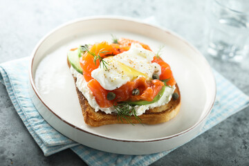 Poached egg with salmon and avocado on toast