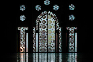 the daily life of different people at the Hassan II Mosque in Casablanca, the pray, talk, and spent time together on a normal summer day.  The mosque has unique and Arabic doors and towers
