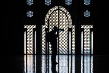 the daily life of different people at the Hassan II Mosque in Casablanca, the pray, talk, and spent...