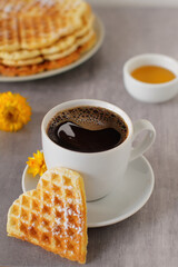 Belgian waffles with powder sugar for serving with coffee 