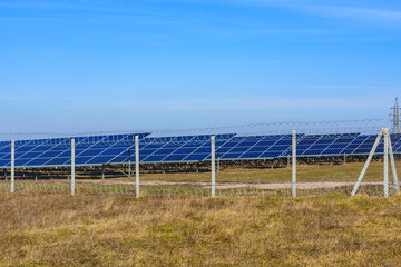 Many solar panels in a field. Clean energy. Ecological concept