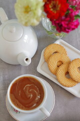 Coffee latte and biscuits on a table