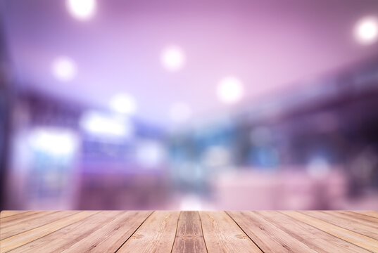 Selected Focus Empty Brown Wooden Table And Coffee Shop Or Restaurent Blur Background With Bokeh Image. For Your Photomontage Or Product Display.