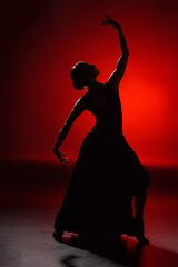 silhouette of elegant girl dancing flamenco on red - obrazy, fototapety, plakaty