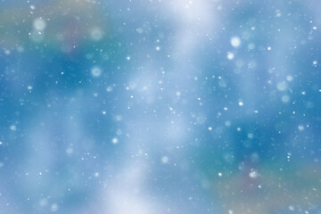blurred snow / winter abstract background, snowflakes on abstract blurred glowing leaf background
