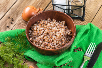 boiled buckwheat porridge on a wooden background