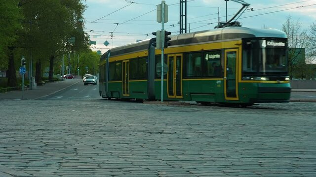 Public transport. Tram on paved city street.