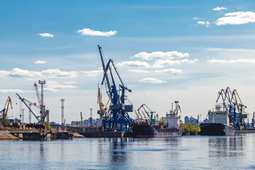cargo cranes in a river port