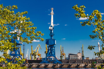 Naklejka premium cargo cranes in a river port