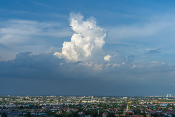 The sunlight shines at the beautiful white clouds in the blue sky And the ground floor is a view of Bangkok