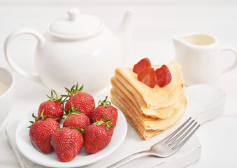 Strawberries and pancakes. Pancakes with strawberries. Romantic breakfast. Valentine's Day. Greeting Card Mother's Day. Breakfast in hotel room. Maslenitsa. Pancake week. Women's Day Congratulation