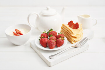 Strawberries and pancakes. Pancakes with strawberries. Romantic breakfast. Valentine's Day. Greeting Card Mother's Day. Breakfast in hotel room. Maslenitsa. Pancake week. Women's Day Congratulation