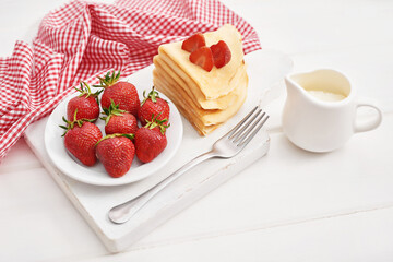 Strawberries and pancakes. Pancakes with strawberries. Romantic breakfast. Valentine's Day. Greeting Card Mother's Day. Breakfast in hotel room. Maslenitsa. Pancake week. Women's Day Congratulation