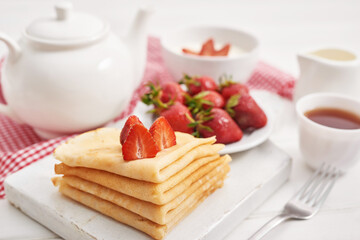 Strawberries and pancakes. Pancakes with strawberries. Romantic breakfast. Valentine's Day. Greeting Card Mother's Day. Breakfast in hotel room. Maslenitsa. Pancake week. Women's Day Congratulation