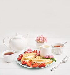Strawberries and pancakes. Pancakes with strawberries. Romantic breakfast. Valentine's Day. Greeting Card Mother's Day. Breakfast in hotel room. Maslenitsa. Pancake week. Women's Day Congratulation