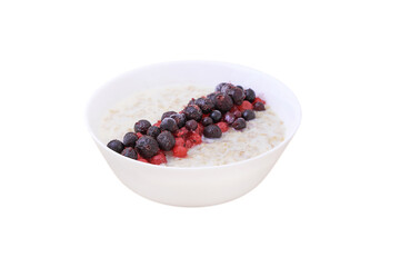 Oatmeal in a white bowl of blueberries and red currants. Healthy Breakfast
