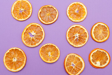 Dried slices of orange isolated on purple background