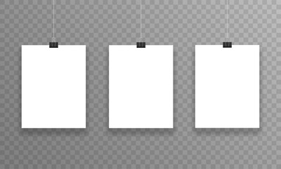 Three realistic sheets of paper hanging on paper clips on a transparent background. Vector.