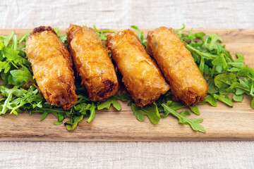pork spring rolls Rice cakes stuffed with a pork stuffing accompanied by sauce