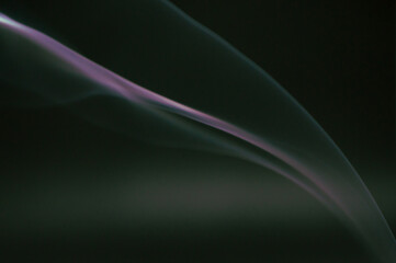 Smoke scented candles on a black background