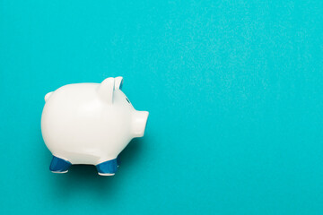 Cute piggy bank isolated on color background,view from the top