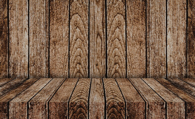 old dark brown wooden table with wood wall useful for background