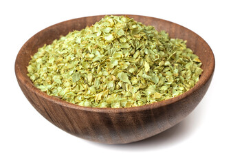 dried oregano flakes in the wooden bowl, isolated on white background