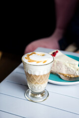 A glass of Latte macchiato with rich milk foam in a cafe