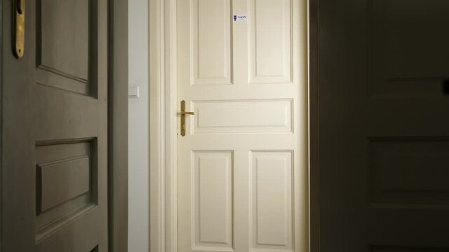 Young man run into restroom holding his butt and slam the door; shot through the door