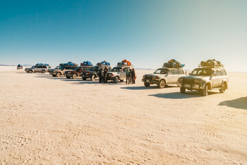 Off-road vehicles parked in line in a rest area in Uyuni © jfStock