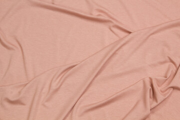 Fabric cotton fold, top view. Beige textile