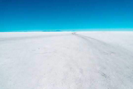 Infinite white road to the blue horizon in Bolivia's Salar