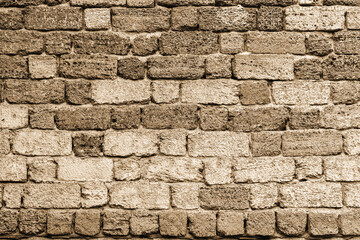 Old concrete, weathered, worn walls lined with natural stone. Grungy Concrete Surface. Great background or texture.